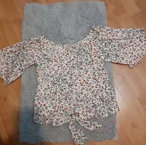 Shoulder showing flower shirt